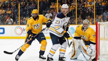 NASHVILLE, TN - MARCH 31: Sam Reinhart #23 of the Buffalo Sabres battles between P.K. Subban #76 and Juuse Saros #74 of the Nashville Predators during an NHL game at Bridgestone Arena on March 31, 2018 in Nashville, Tennessee. (Photo by John Russell/NHLI via Getty Images) *** Local Caption *** Sam Reinhart;P.K. Subban;Juuse Saros
