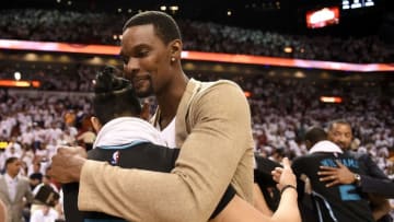 May 1, 2016; Miami, FL, USA; Miami Heat forward Chris Bosh (right) embraces Charlotte Hornets guard Jeremy Lin (left) after game seven of the first round of the NBA Playoffs at American Airlines Arena. The Heat won 106-73. Mandatory Credit: Steve Mitchell-USA TODAY Sports