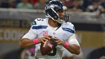 Oct 19, 2014; St. Louis, MO, USA; Seattle Seahawks quarterback Russell Wilson (3) drops back to pass during the first half against the St. Louis Rams at the Edward Jones Dome. Mandatory Credit: Jeff Curry-USA TODAY Sports