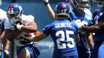 Jun 18, 2014; East Rutherford, NJ, USA; New York Giants running back Rashad Jennings (23) carries the ball during New York Giants mini camp at Quest Diagnostics Training Center. Mandatory Credit: Noah K. Murray-USA TODAY Sports