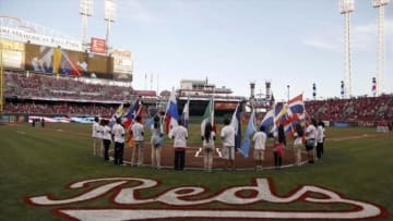 Sep 27, 2013; Cincinnati, OH, USA; A group of young people hold flags representing the countries of Latin America prior to a game between the Pittsburgh Pirates and the Cincinnati Reds at Great American Ball Park. Mandatory Credit: David Kohl-USA TODAY Sports