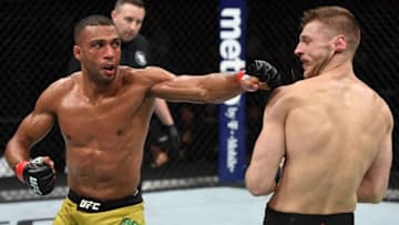 MILWAUKEE, WISCONSIN - DECEMBER 15: (L-R) Edson Barboza of Brazil punches Dan Hooker of New Zealand in their lightweight bout during the UFC Fight Night event at Fiserv Forum on December 15, 2018 in Milwaukee, Wisconsin. (Photo by Jeff Bottari/Zuffa LLC/Zuffa LLC via Getty Images)