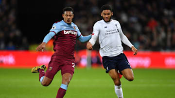 LONDON, ENGLAND - JANUARY 29: Joe Gomez of Liverpool is tackled by Sebastien Haller of West Ham United during the Premier League match between West Ham United and Liverpool FC at London Stadium on January 29, 2020 in London, United Kingdom. (Photo by Justin Setterfield/Getty Images)
