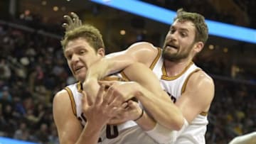 Mar 20, 2015; Cleveland, OH, USA; Cleveland Cavaliers center Timofey Mozgov (20) grabs a rebound beside forward Kevin Love (0) in the first quarter against the Indiana Pacers at Quicken Loans Arena. Mandatory Credit: David Richard-USA TODAY Sports
