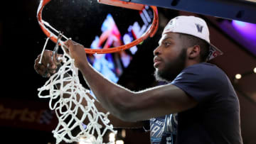 NEW YORK, NEW YORK - MARCH 16: Eric Paschall #4 of the Villanova Wildcats cuts a piece of the net after the 74-72 win over the Seton Hall Pirates during the Big East Championship Game at Madison Square Garden on March 16, 2019 in New York City. (Photo by Elsa/Getty Images)