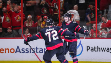 OTTAWA, CANADA - FEBRUARY 13: Tim Stützle #18 of the Ottawa Senators celebrates his overtime game winning goal against the Calgary Flames with Thomas Chabot #72 at Canadian Tire Centre on February 13, 2023 in Ottawa, Ontario, Canada. (Photo by Chris Tanouye/Freestyle Photography/Getty Images)