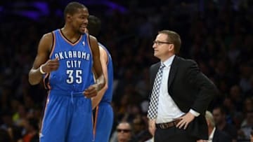 Feb 13, 2014; Los Angeles, CA, USA; Oklahoma City Thunder forward Kevin Durant (35) talks with Oklahoma City Thunder head coach Scott Brooks during the game against the Los Angeles Lakers during the fourth quarter at the Staples Center. The Oklahoma City Thunder defeated the Los Angeles Lakers 107-103. Mandatory Credit: Kelvin Kuo-USA TODAY Sports