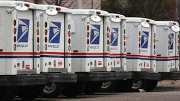 FARMINGDALE, NY - APRIL 12: A general view of United States Postal Service trucks on April 12, 2020 in Farmingdale, New York. The USPS requested $75B in government assistance on April 9 to help recover from a large drop in mail volume. (Photo by Bruce Bennett/Getty Images)