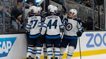Oct 30, 2021; San Jose, California, USA; Winnipeg Jets defenseman Josh Morrissey (44) celebrates with teammates during the third period against the San Jose Sharks at SAP Center at San Jose. Mandatory Credit: Stan Szeto-USA TODAY Sports