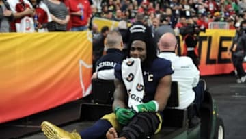 Jan 1, 2016; Glendale, AZ, USA; Notre Dame Fighting Irish linebacker Jaylon Smith (9) is carted off the field after being injured against the Ohio State Buckeyes during the first half of the 2016 Fiesta Bowl at University of Phoenix Stadium. Mandatory Credit: Joe Camporeale-USA TODAY Sports
