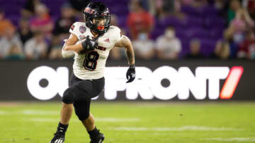 Auburn footballDec 17, 2021; Orlando, Florida, USA; Northern Illinois Huskies running back Jay Ducker (8) runs with the ball during the second half against the Coastal Carolina Chanticleers during the 2021 Cure Bowl at Exploria Stadium. Mandatory Credit: Matt Pendleton-USA TODAY Sports