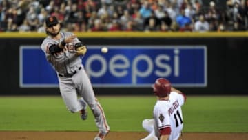 Sep 7, 2015; Phoenix, AZ, USA; San Francisco Giants shortstop Brandon Crawford (35) turns a double play on Arizona Diamondbacks center fielder A.J. Pollock (11) during the first inning at Chase Field. Mandatory Credit: Matt Kartozian-USA TODAY Sports