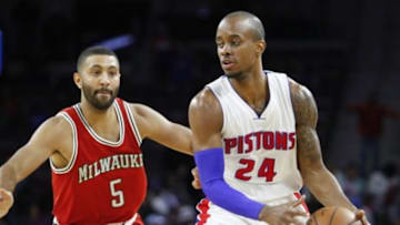 Oct 9, 2014; Auburn Hills, MI, USA; Detroit Pistons guard Lorenzo Brown (24) defended by Milwaukee Bucks guard Kendall Marshall (5) during the fourth quarter at The Palace of Auburn Hills. Pistons beat the Bucks 94-80. Mandatory Credit: Raj Mehta-USA TODAY Sports