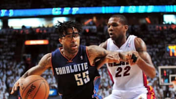 Apr 20, 2014; Miami, FL, USA; Charlotte Bobcats guard Chris Douglas-Roberts (55) is pressured by Miami Heat forward James Jones (22) during the second half in game one during the first round of the 2014 NBA Playoffs at American Airlines Arena. The Heat won 99-88. Mandatory Credit: Steve Mitchell-USA TODAY Sports