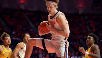 Feb 20, 2023; Champaign, Illinois, USA; Illinois Fighting Illini forward Matthew Mayer (24) grabs a rebound during the second half against the Minnesota Golden Gophers at State Farm Center. Mandatory Credit: Ron Johnson-USA TODAY Sports