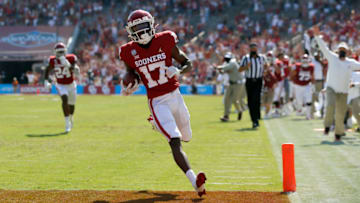Oct 10, 2020; Dallas, Texas, USA; Oklahoma player Marvin Mims (17) scores a touchdown during the Red River Showdown college football game between the Oklahoma Sooners (OU) and the Texas Longhorns (UT) at Cotton Bowl Stadium in Dallas, Saturday, Oct. 10, 2020. Mandatory Credit: Bryan Terry-USA TODAY NETWORK