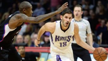 Jan 16, 2016; Los Angeles, CA, USA; Sacramento Kings forward Omri Casspi (18) drives to the basket past Los Angeles Clippers forward Jamal Crawford during the 1st half at Staples Center. Mandatory Credit: Robert Hanashiro-USA TODAY Sports