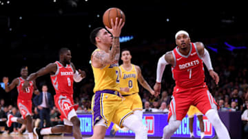LOS ANGELES, CA - OCTOBER 20: Lonzo Ball #2 of the Los Angeles Lakers drives to the basket in front of Carmelo Anthony #7 of the Houston Rockets during a 124-115 Rockets win at Staples Center on October 20, 2018 in Los Angeles, California. (Photo by Harry How/Getty Images)