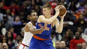 Jan 5, 2016; Atlanta, GA, USA; New York Knicks forward Kristaps Porzingis (6) makes a move against Atlanta Hawks center Al Horford (15) in the fourth quarter of their game at Philips Arena. The Knicks won 107-101. Mandatory Credit: Jason Getz-USA TODAY Sports