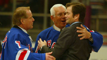 New York Rangers Mike Richter is greeted by former Rangers Rod Gilbert #7 and Ed Giacomin during Richter's #35 jersey retirement ceremony. (Photo by Al Bello/Getty Images)