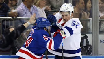 NEW YORK, NEW YORK - JUNE 03: Tyler Motte #64 of the New York Rangers fights with Cal Foote #52 of the Tampa Bay Lightning during the third period in Game Two of the Eastern Conference Final of the 2022 Stanley Cup Playoffs at Madison Square Garden on June 03, 2022 in New York City. (Photo by Bruce Bennett/Getty Images)