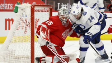 May 2, 2021; Detroit, Michigan, USA; Tampa Bay Lightning left wing Pat Maroon (14) tries to score on Detroit Red Wings goaltender Jonathan Bernier (45) in the third period at Little Caesars Arena. Mandatory Credit: Rick Osentoski-USA TODAY Sports
