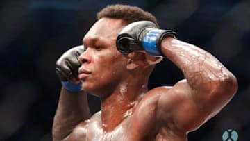 Middleweight title winner Israel Adesanya of New Zealand celebrates after defeating Robert Whittaker of Australia during the middleweight title bout of the UFC 243 fight night in Melbourne on October 6, 2019. (Photo by ASANKA BRENDON RATNAYAKE / AFP) / -- IMAGE RESTRICTED TO EDITORIAL USE - STRICTLY NO COMMERCIAL USE -- (Photo by ASANKA BRENDON RATNAYAKE/AFP via Getty Images)