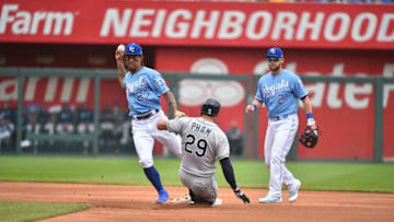 KANSAS CITY, MO - MAY 02: Adalberto Mondesi #27 of the Kansas City Royals throws to first past Tommy Pham #29 of the Tampa Bay Rays to complete a double play at Kauffman Stadium on May 2, 2019 in Kansas City, Missouri. (Photo by Ed Zurga/Getty Images)
