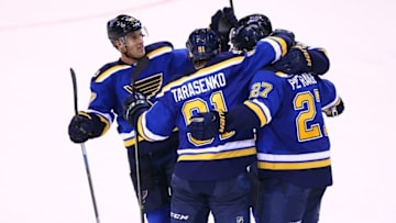 Nov 9, 2016; St. Louis, MO, USA; St. Louis Blues defenseman Alex Pietrangelo (27) is congratulated by teammates Vladimir Tarasenko (91) and Jaden Schwartz (17) after scoring a goal against the Chicago Blackhawks during the third period at Scottrade Center. The Blackhawks won 2-1 in overtime. Mandatory Credit: Billy Hurst-USA TODAY Sports