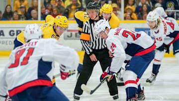 NASHVILLE, TN - SEPTEMBER 8: Refree Kelly Cooke drops the puck between Connor McMichael #24 of the Washington Capitals and Hugo Roy #65 of the Nashville Predators during an NHL Prospects game at Ford Ice Center on September 8, 2019 in Antioch, Tennessee. (Photo by John Russell/NHLI via Getty Images)