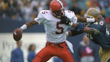 11 Nov 1995: Quarterback Donovan McNabb of the Syracuse Orangemen tries to break away from linebacker Zatiti Moody of the Pittsburgh Panthers at Pitt Stadium in Pittsburgh, Pennsylvania. Syracuse won the game 42-10. Mandatory Credit: Rick Stewart /Alls