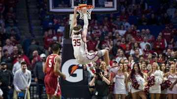Dec 11, 2021; Tulsa, Oklahoma, USA; Oklahoma Sooners forward Tanner Groves (35) dunks as Arkansas Razorbacks guard Au'Diese Toney (5) looks on during the second half at BOK Center. Oklahoma won 88-66. Mandatory Credit: Brett Rojo-USA TODAY Sports