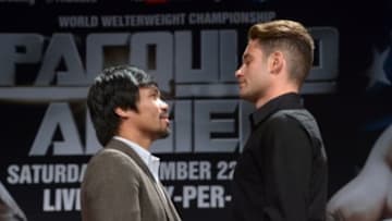 Sep 3, 2014; Los Angeles, CA, USA; Manny Pacquiao (left) and Chris Algieri pose at press conference at Hyatt Regency Century Plaza Hotel in advance of World Welterweight Championship bout on Nov. 22, 2014. Mandatory Credit: Kirby Lee-USA TODAY Sports