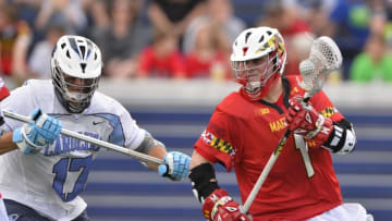 May 17, 2015; Annapolis, MD, USA; Maryland Terrapins attack Matt Rambo (1) drives to the net as North Carolina Tar Heels defense Austin Pifani (17) defends during the first half at Navy Marine Corps Memorial Stadium. Mandatory Credit: Tommy Gilligan-USA TODAY Sports