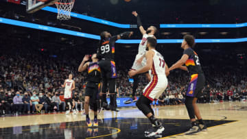 Miami Heat forward Caleb Martin (16) shoots over Phoenix Suns forward Jae Crowder (99)(Joe Camporeale-USA TODAY Sports)