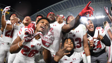 MIAMI GARDENS, FL - DECEMBER 30: Wisconsin Badgers players celebrate winning the 2017 Capital One Orange Bowl against the Miami Hurricanes at Hard Rock Stadium on December 30, 2017 in Miami Gardens, Florida. (Photo by Rob Foldy/Getty Images)