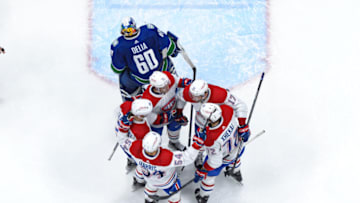 VANCOUVER, CANADA - DECEMBER 5: Josh Anderson #17 is congratulated by Jake Evans #71 Juraj Slafkovsky #20 Jordan Harris #54 and Arber Xhekaj #72 of the Montréal Canadiens after scoring a goal against Collin Delia #60 of the Vancouver Canucks during the third period of their NHL game at Rogers Arena on December 5, 2022 in Vancouver, British Columbia, Canada. Vancouver won 7-6. (Photo by Derek Cain/Getty Images)