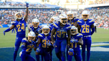 CARSON, CA - DECEMBER 03: Trevor Williams #24, Rayshawn Jenkins #25, Adrian Phillips #31, Casey Hayward #26, Jahleel Addae #37, Jatavis Brown #57, and Michael Davis #43 of the Los Angeles Chargers celebrate recovering a fumble during the fourth quarter of a game against the Cleveland Browns at StubHub Center on December 3, 2017 in Carson, California. (Photo by Sean M. Haffey/Getty Images)