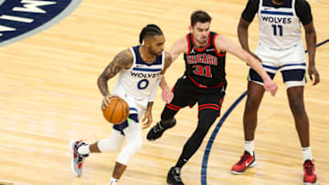 MINNEAPOLIS, MN - APRIL 11: D'Angelo Russell #0 of the Minnesota Timberwolves dribbles the ball while Tomas Satoransky #31 of the Chicago Bulls defends in the first quarter of the game at Target Center on April 11, 2021 in Minneapolis, Minnesota. The Timberwolves defeated the Bulls 121-117. NOTE TO USER: User expressly acknowledges and agrees that, by downloading and or using this Photograph, user is consenting to the terms and conditions of the Getty Images License Agreement. (Photo by David Berding/Getty Images)