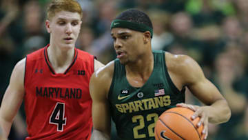 EAST LANSING, MI - JANUARY 4: Miles Bridges #22 of the Michigan State Spartans drives to the basket defended by Kevin Huerter #4 of the Maryland Terrapins at Breslin Center on January 4, 2018 in East Lansing, Michigan. (Photo by Rey Del Rio/Getty Images)
