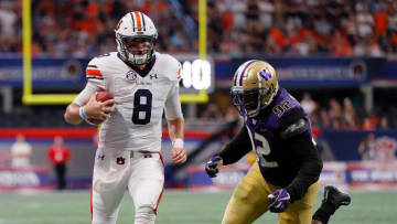 ATLANTA, GA - SEPTEMBER 01: Jarrett Stidham #8 of the Auburn Tigers rushes away from Jaylen Johnson #92 of the Washington Huskies at Mercedes-Benz Stadium on September 1, 2018 in Atlanta, Georgia. (Photo by Kevin C. Cox/Getty Images)