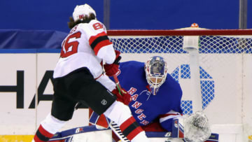 NEW YORK, NEW YORK - JANUARY 19: Jack Hughes #86 of the New Jersey Devils scores his second goal of the second period at 8:38 against Alexandar Georgiev #40 of the New York Rangers at Madison Square Garden on January 19, 2021 in New York City. (Photo by Bruce Bennett/Getty Images)