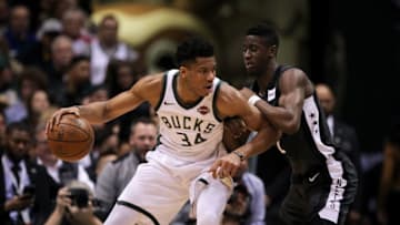 MILWAUKEE, WI - APRIL 05: Giannis Antetokounmpo #34 of the Milwaukee Bucks dribbles the ball while being guarded by Caris LeVert #22 of the Brooklyn Nets in the second quarter at the Bradley Center on April 5, 2018 in Milwaukee, Wisconsin. NOTE TO USER: User expressly acknowledges and agrees that, by downloading and or using this photograph, User is consenting to the terms and conditions of the Getty Images License Agreement. (Dylan Buell/Getty Images) *** Local Caption *** Giannis Antetokounmpo;Caris LeVert