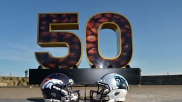 Feb 6, 2016; San Francisco, CA, USA; General view of Carolina Panthers and Denver Broncos helmets with NFL Wilson Duke football at Super Bowl 50 sculpture at Twin Peaks. Mandatory Credit: Kirby Lee-USA TODAY Sports