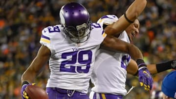 Jan 3, 2016; Green Bay, WI, USA; Minnesota Vikings cornerback Xavier Rhodes (29) celebrates with cornerback Josh Robinson (21) after intercepting a pass in the fourth quarter during the game against the Green Bay Packers at Lambeau Field. Mandatory Credit: Benny Sieu-USA TODAY Sports