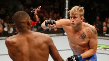 TORONTO, CANADA - SEPTEMBER 21: (R-L) Alexander 'The Mauler' Gustafsson punches Jon 'Bones' Jones in their UFC light heavyweight championship bout at the Air Canada Center on September 21, 2013 in Toronto, Ontario, Canada. (Photo by Josh Hedges/Zuffa LLC/Zuffa LLC via Getty Images)