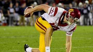 PASADENA, CA - JANUARY 02: Quarterback Sam Darnold #14 of the USC Trojans stumbles prior to throwing a touchdown pass in the third quarter against the Penn State Nittany Lions during the 2017 Rose Bowl Game presented by Northwestern Mutual at the Rose Bowl on January 2, 2017 in Pasadena, California. (Photo by Harry How/Getty Images)