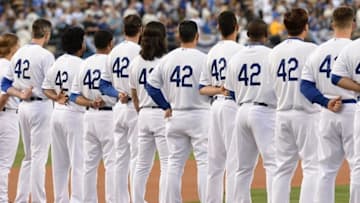 Apr 15, 2015; Los Angeles, CA, USA; Los Angeles Dodgers line up for the National Anthem to commemorate Jackie Robinson Day before the game against the Seattle Mariners at Dodger Stadium. Mandatory Credit: Jayne Kamin-Oncea-USA TODAY Sports