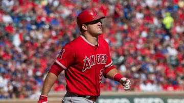 Oct 4, 2015; Arlington, TX, USA; Los Angeles Angels center fielder Mike Trout (27) reacts to getting hit with the ball by Texas Rangers starting pitcher Cole Hamels (not pictured) during the seventh inning at Globe Life Park in Arlington. The Rangers won 9-2 and clinch the American League West division. Mandatory Credit: Jerome Miron-USA TODAY Sports