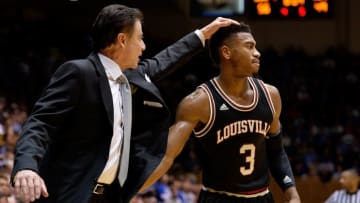 DURHAM, NC - FEBRUARY 08: Head coach Rick Pitino talks to Trey Lewis #3 of the Louisville Cardinals during their game against the Louisville Cardinals at Cameron Indoor Stadium on February 8, 2016 in Durham, North Carolina. Duke won 72-65. (Photo by Grant Halverson/Getty Images)